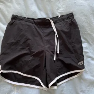 Never worn: New Balance black &amp; white running shorts